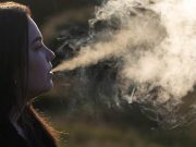 Recent CDC Data: Over 2 Million U.S. Students Reported Vaping in 2021 Woman vaping