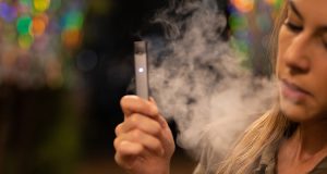 woman vaping juul e-cig