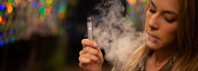 woman vaping juul e-cig