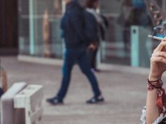 woman smoking in the street