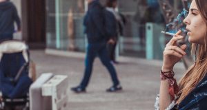 woman smoking in the street