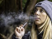 young woman vaping juul