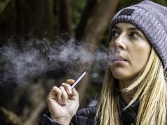 young woman vaping juul