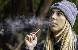 young woman vaping juul