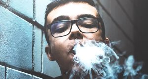 young man vaping