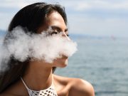 young woman vaping in Hawaii