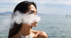 young woman vaping in Hawaii