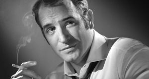Jean Dujardin smoking a cigarette