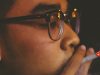 young man smoking a cigarette