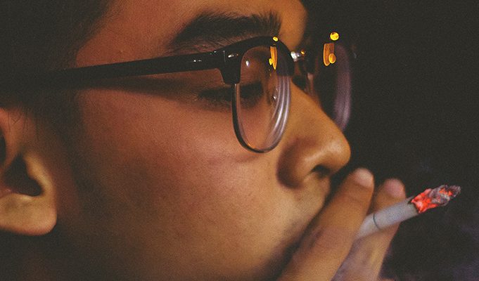 Another Day, Another Country—This Time South Korea—Fighting Nicotine Instead of Smoking young man smoking a cigarette