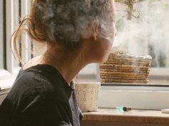 woman smoking inside