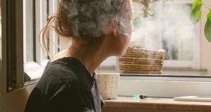 woman smoking inside