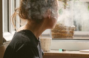 woman smoking inside