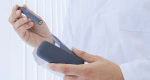 Doctor holding an iQos e-cig