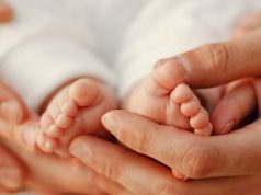 Little baby in his mom's hands
