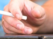 University of Waterloo: COVID-19 Didn’t Spark More Smoking During Its Initial Stages hand of a man smoking a cigarette