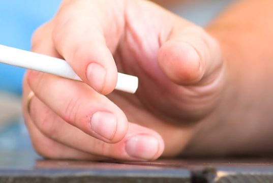 hand of a man smoking a cigarette