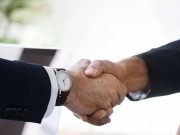 business man shaking hands together