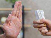man refusing bunch of cigarettes
