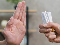 man refusing bunch of cigarettes