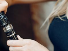 woman filling her vape