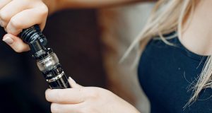 woman filling her vape