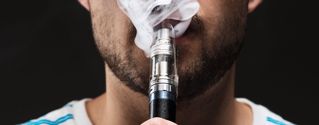 zoom on a man vaping