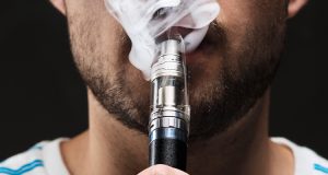 zoom on a man vaping