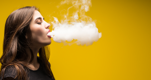 Young woman vaping