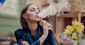 woman vaping outside