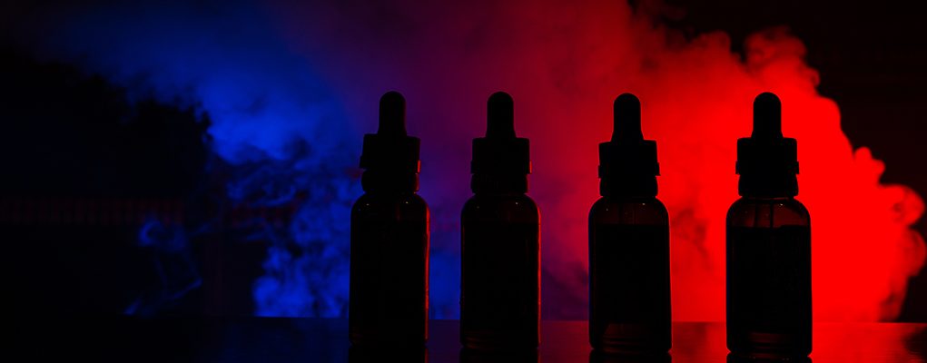 Fluid for electronic cigarettes with a background of a colored cloud of smoke