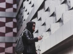 Fashion male dressed in leather jacket vaping