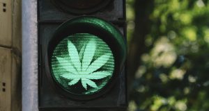 traffic light with cannabis sign - legalize it concept image