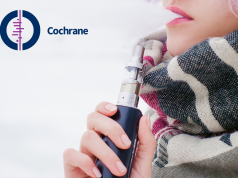 An e-cigarette next to a tobacco cigarette.